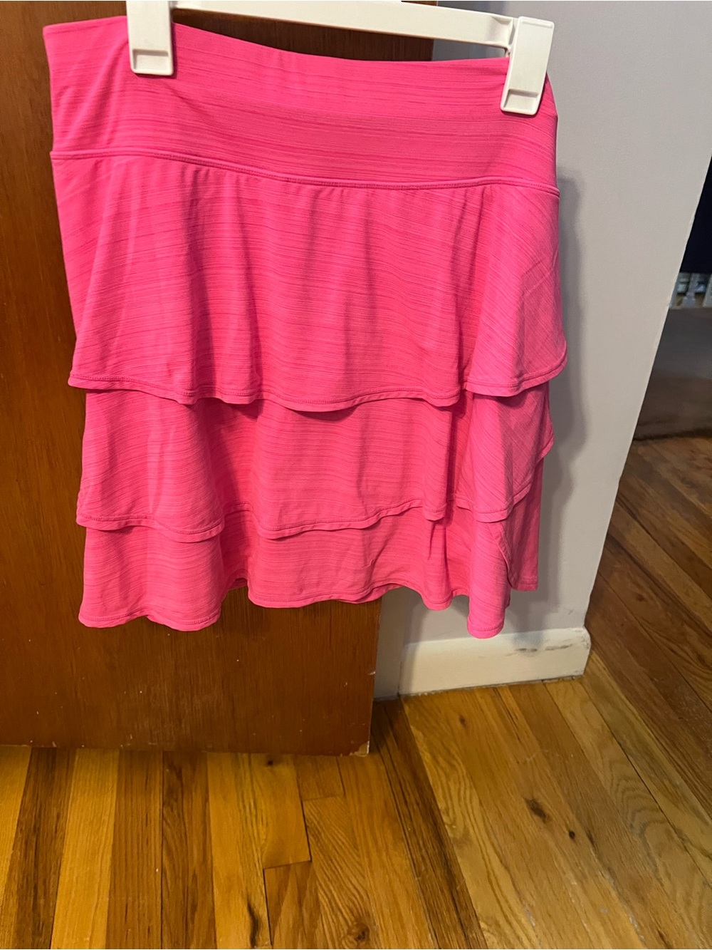 Set of two skorts. Ideology Bright Pink Layered High-Low ruffled skort and black